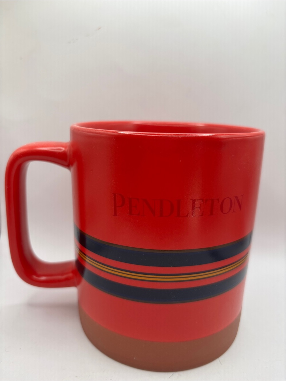 Pendleton Red Ceramic Mug with black and yellow Stripe Accents